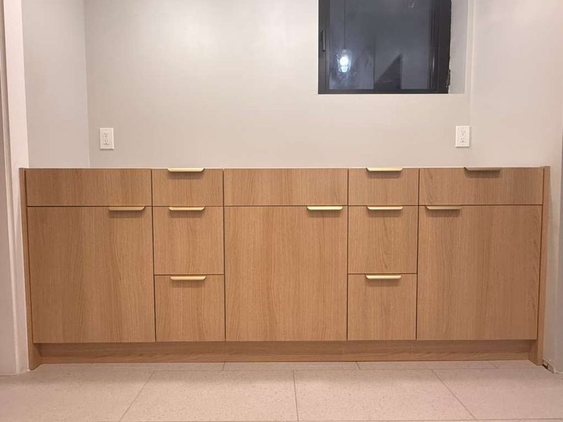 Polished mudroom with custom oak cabinetry