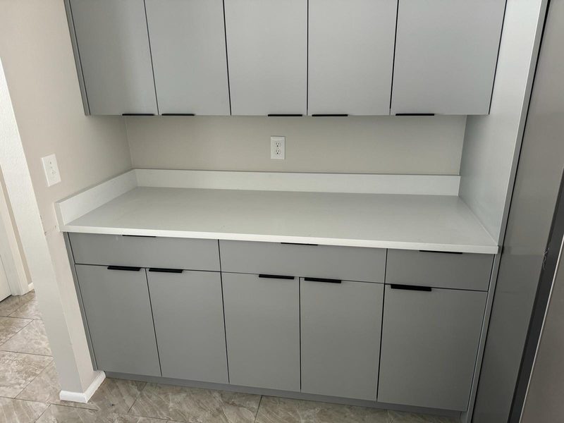 Polished laundry with custom cabinetry
