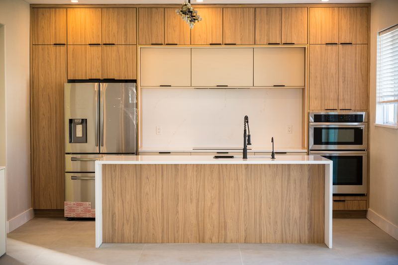 Refined kitchen with custom wood cabinetry