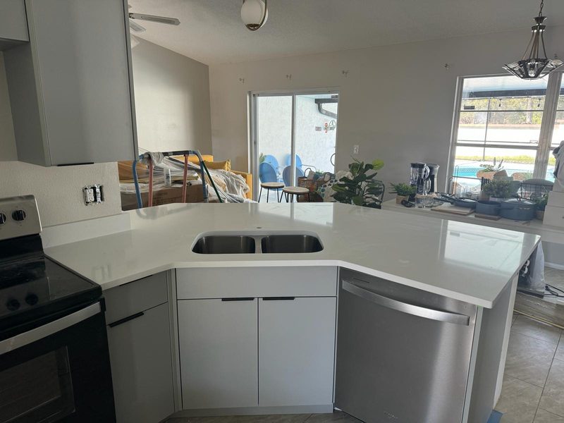 Modern kitchen with curved island cabinetry