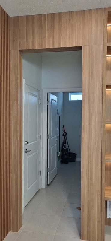 Modern entryway with vertical wood paneling