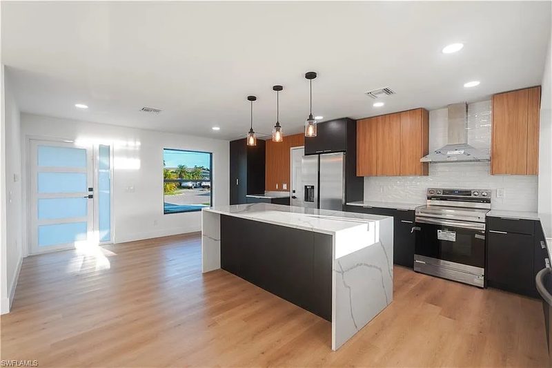 Refined kitchen with custom cabinetry and island