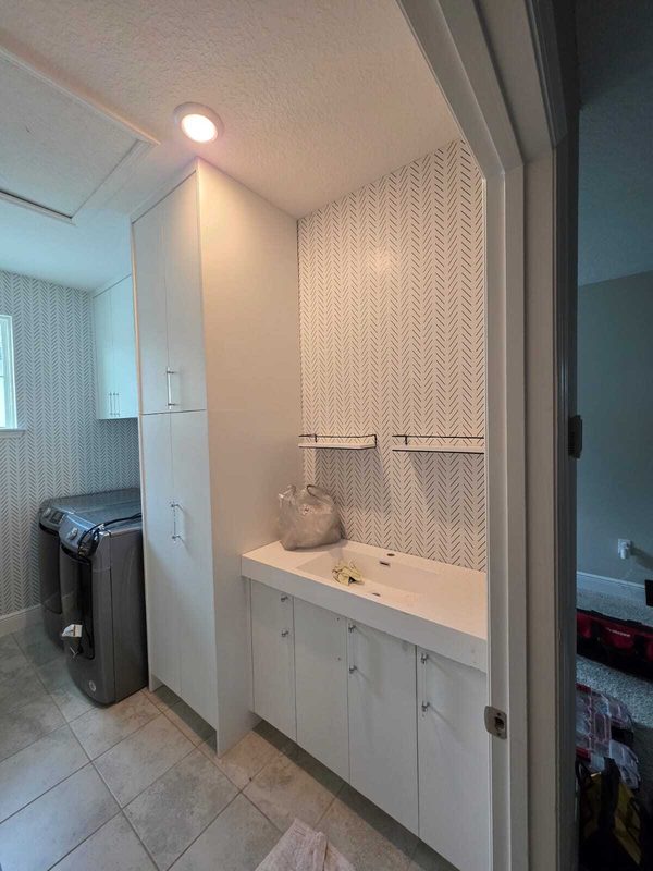 Polished bathroom with custom cabinetry