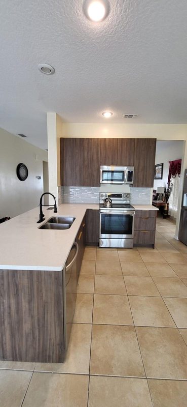Contemporary kitchen with custom wood cabinetry