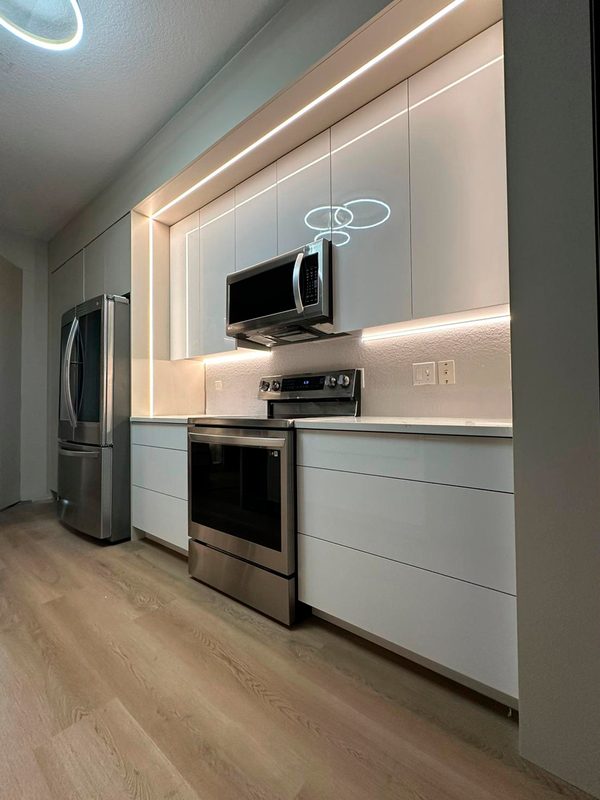 Contemporary Kitchen with Illuminated Cabinetry