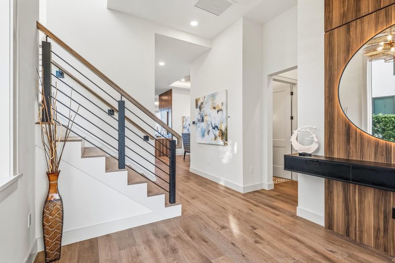 Contemporary entryway with custom wood accent wall