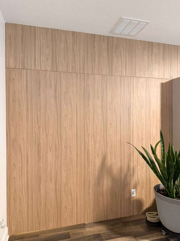 Sophisticated closet with custom wood paneling