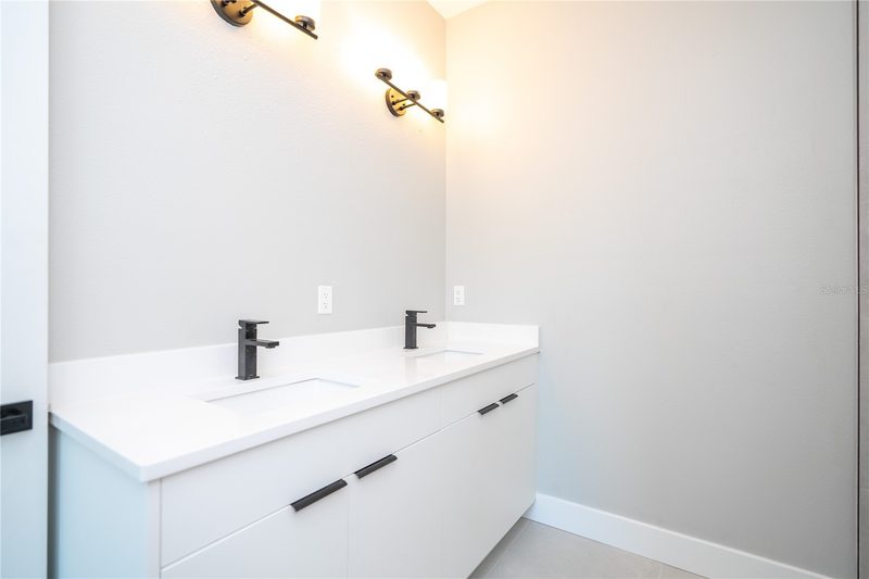 Elegant bathroom with custom dual vanity