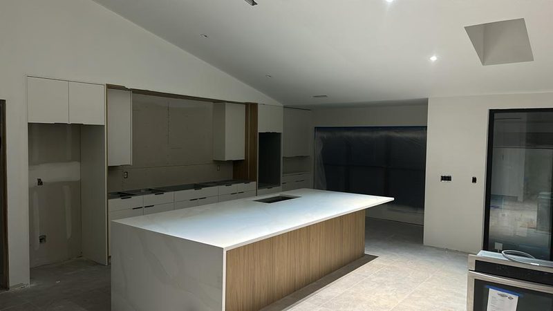 Contemporary kitchen with custom cabinetry and island
