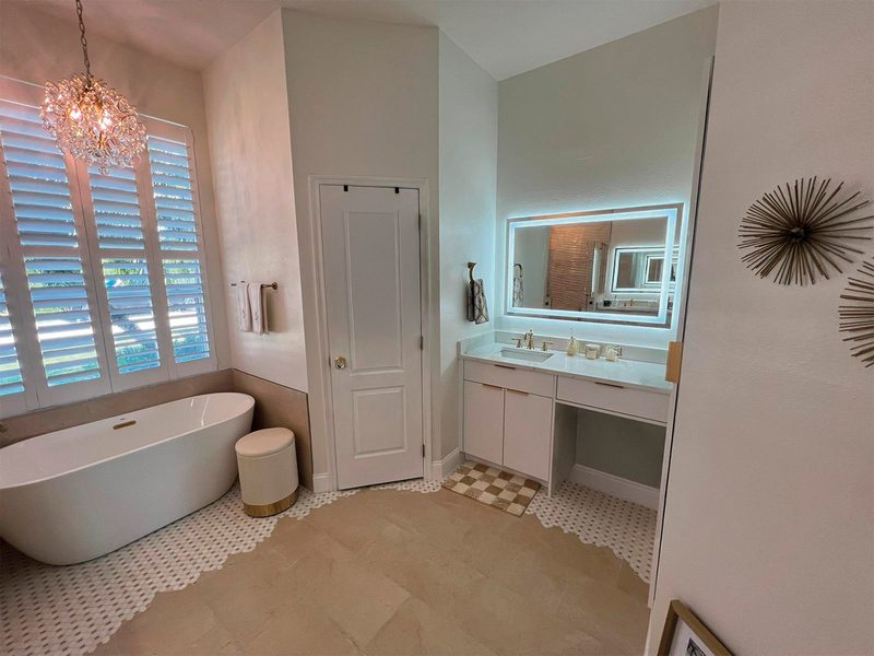 Elegant Primary Bathroom with Illuminated Mirror