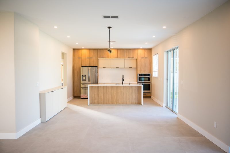 Refined kitchen with custom wood cabinetry