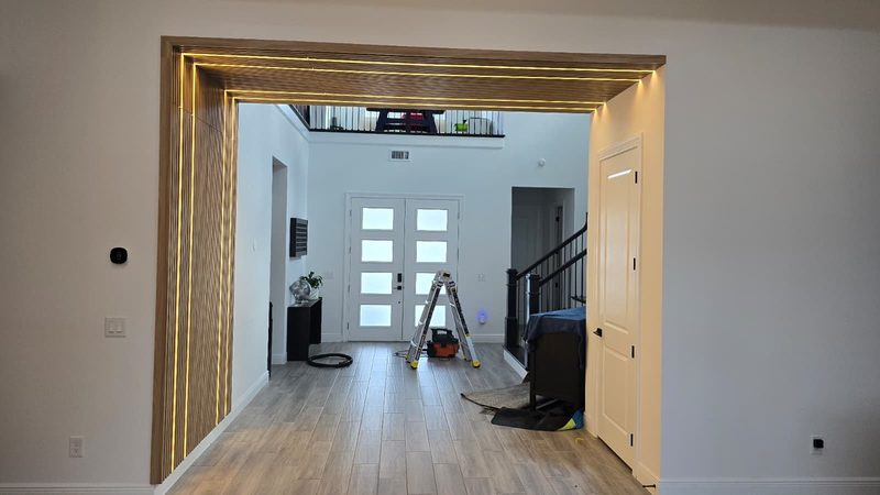 Elegant foyer with custom archway millwork