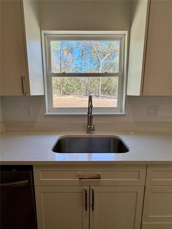 Custom Kitchen with Picture Window Views