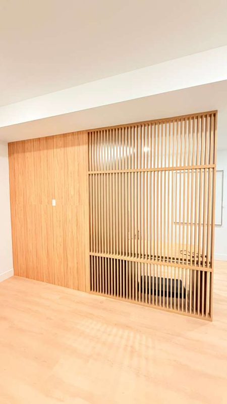 Modern living room with slatted wood partition