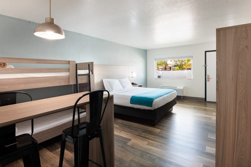 Modern hotel room with integrated workspace