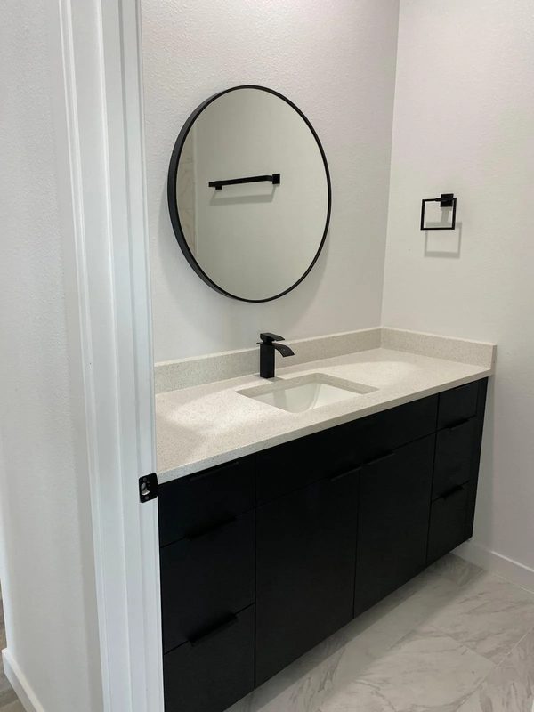 Elegant bathroom with custom vanity and mirror