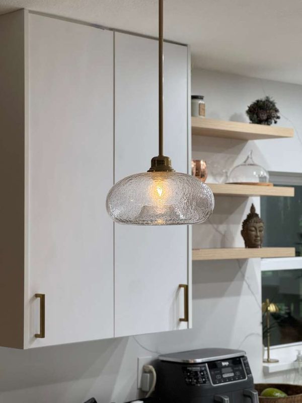 Modern kitchen with textured glass pendant lighting