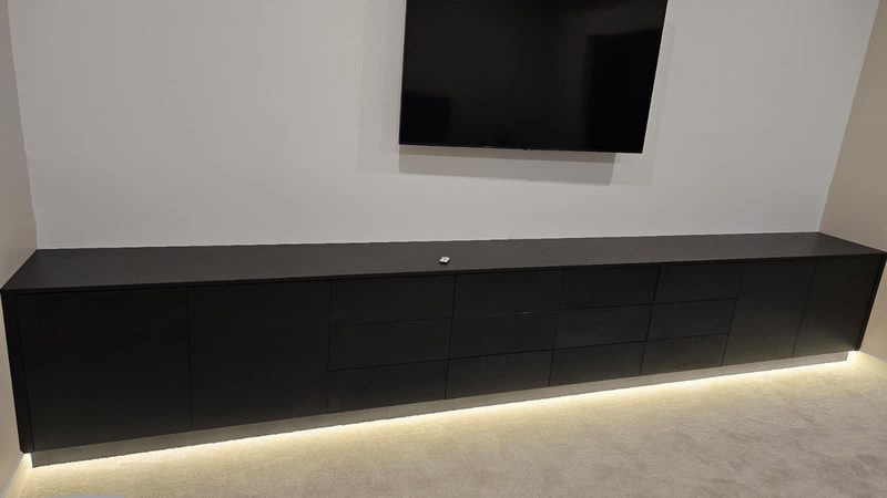 Modern media room with integrated cabinetry