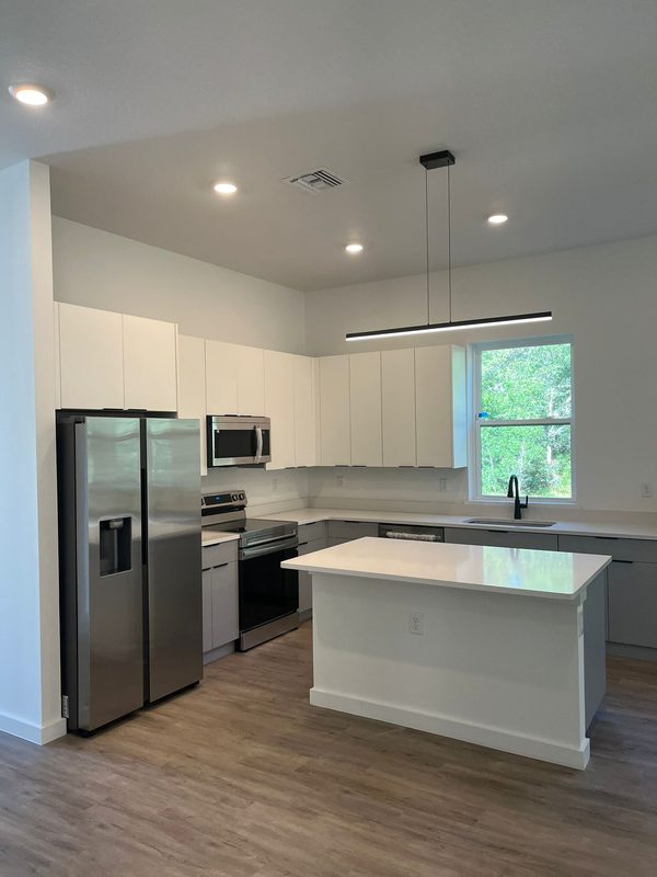 Modern kitchen with custom white cabinetry