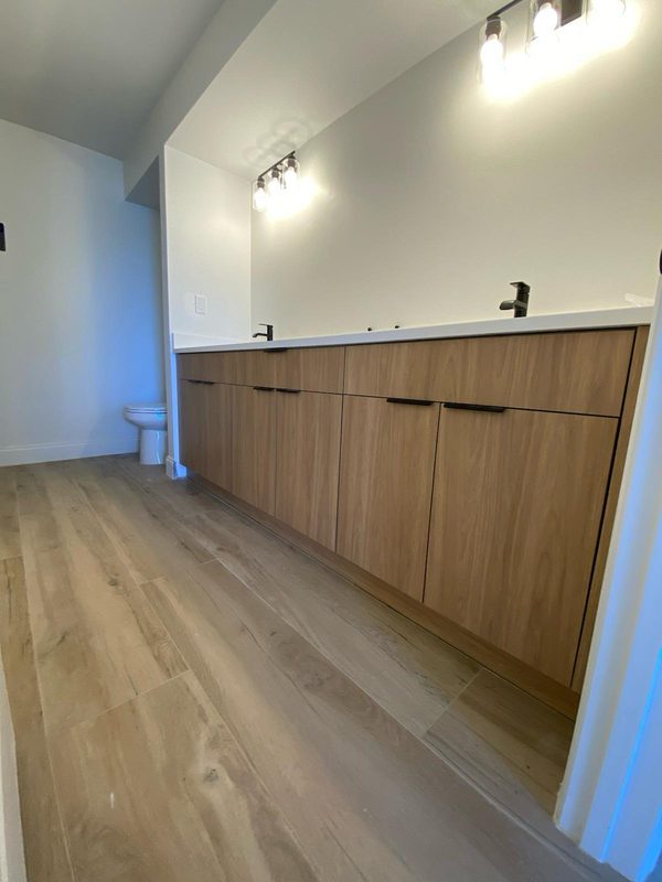 Sleek bathroom with warm wood vanity