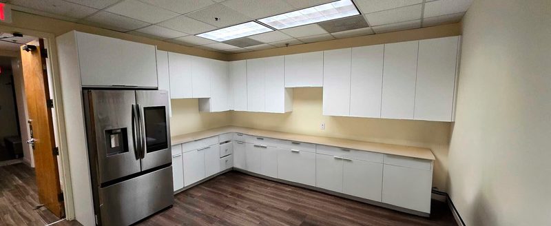 Contemporary kitchen with custom white cabinetry