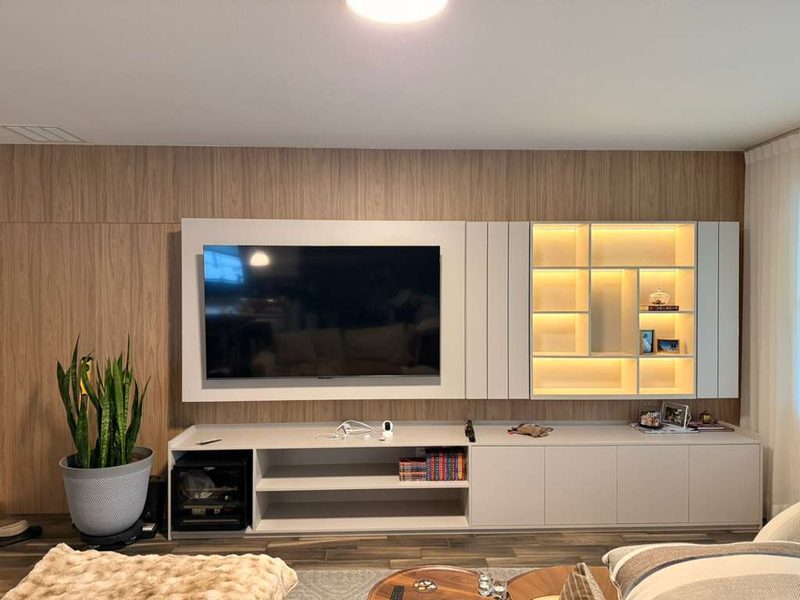 Warm living room with integrated entertainment millwork