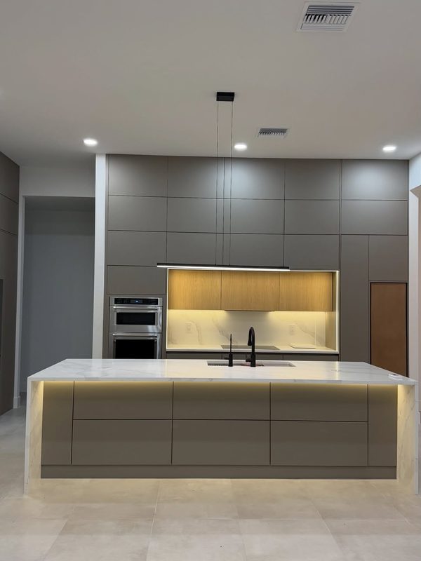 Contemporary kitchen with custom gray cabinetry