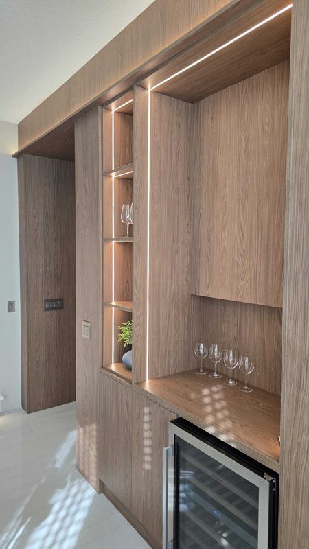 Contemporary wine bar with illuminated shelving