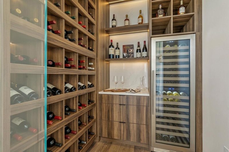 Luxury wine room with custom cabinetry