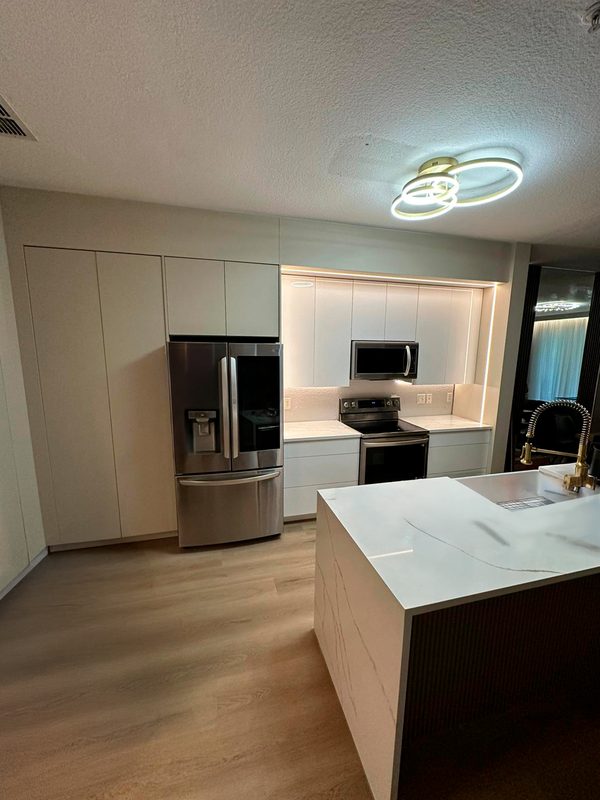 Contemporary kitchen with custom white cabinetry