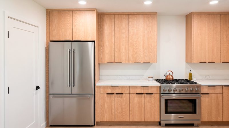 Refined kitchen with custom wood cabinetry