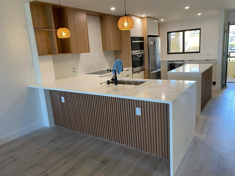 Contemporary kitchen with custom waterfall island