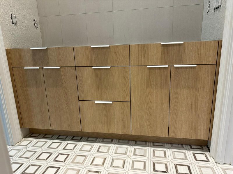 Custom vanity with warm wood cabinetry