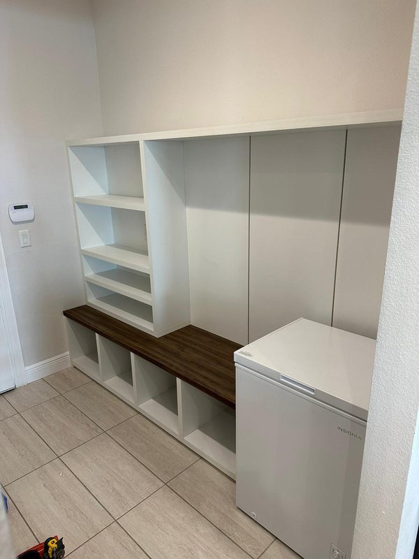 Sophisticated mudroom with custom built-in storage