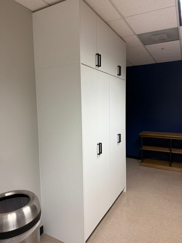 Commercial storage wall with full-height cabinetry