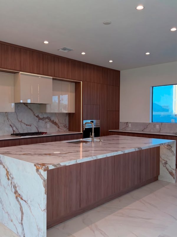 Modern kitchen with marble waterfall island