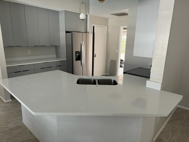Modern kitchen with custom gray cabinetry