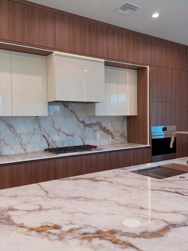 Contemporary Kitchen with Marble Waterfall Island