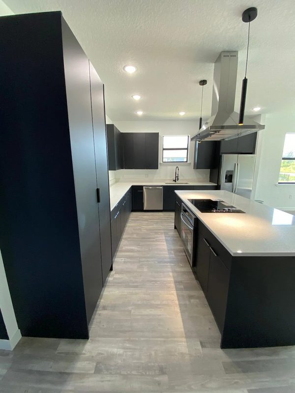 Contemporary kitchen with custom black cabinetry