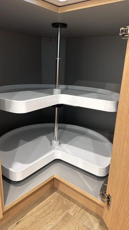 Corner pantry with rotating carousel storage