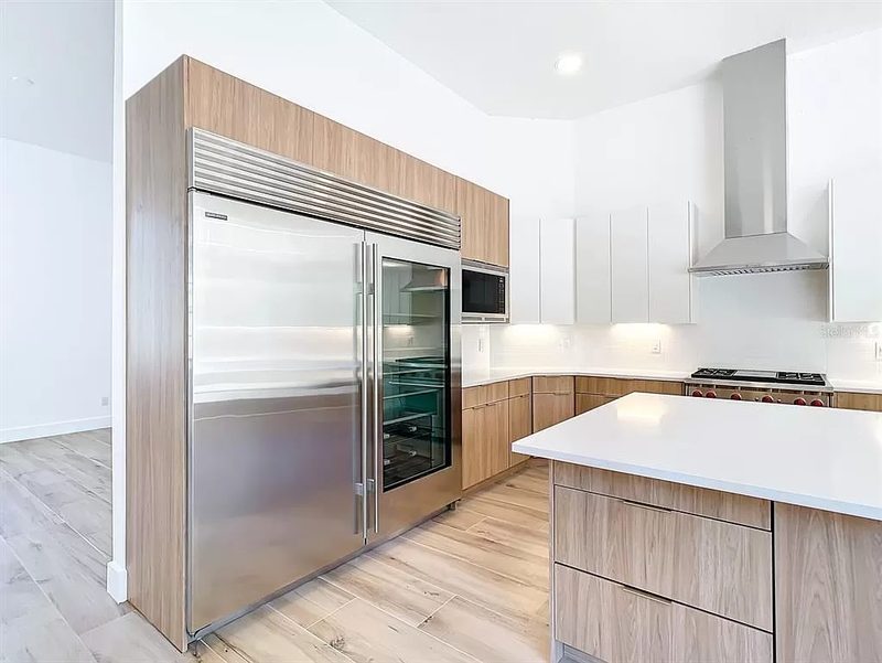 Contemporary kitchen with custom wood cabinetry