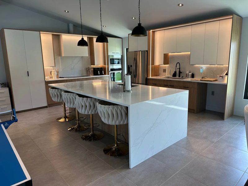 Contemporary kitchen with marble island seating