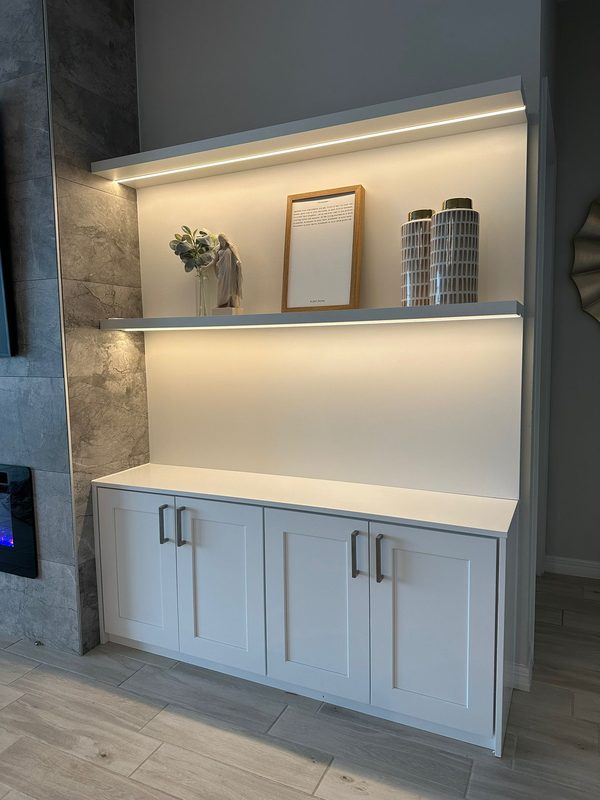 Contemporary living room with illuminated shelving