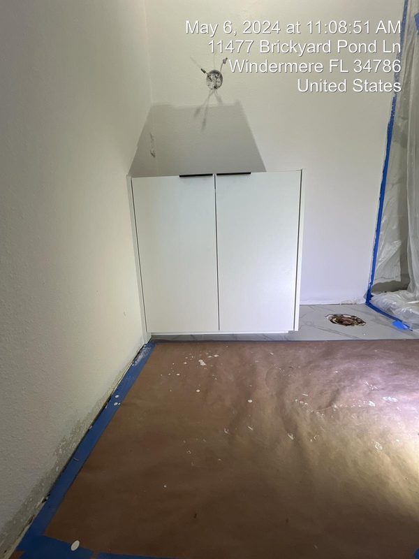 Polished laundry with custom cabinetry