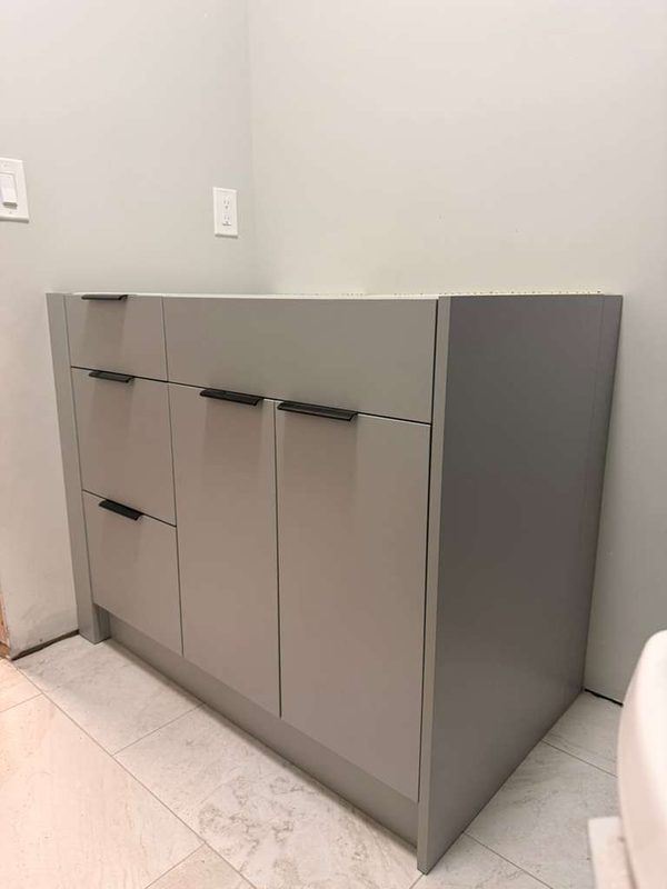 Contemporary bathroom with custom gray cabinetry