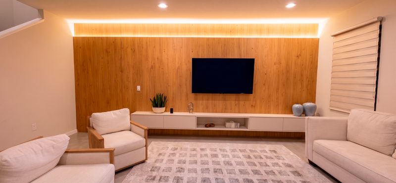 Warm media room with integrated millwork