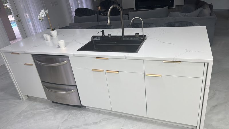 Contemporary kitchen with custom waterfall island