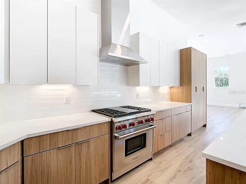 Contemporary kitchen with custom mixed cabinetry