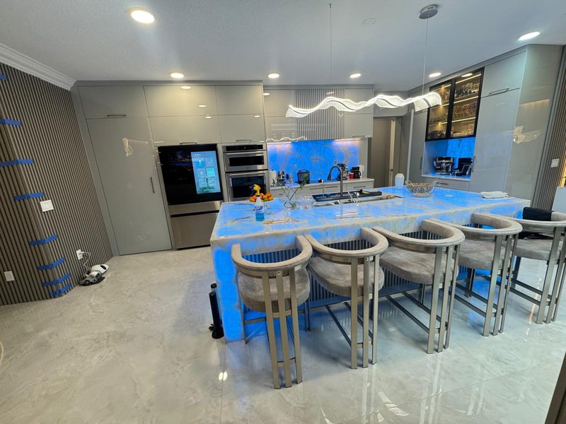 Contemporary kitchen with custom blue island