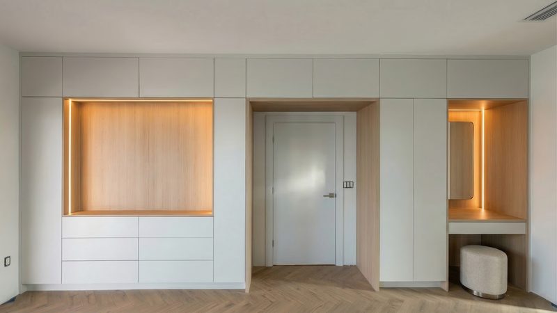 Refined bedroom with backlit display niches